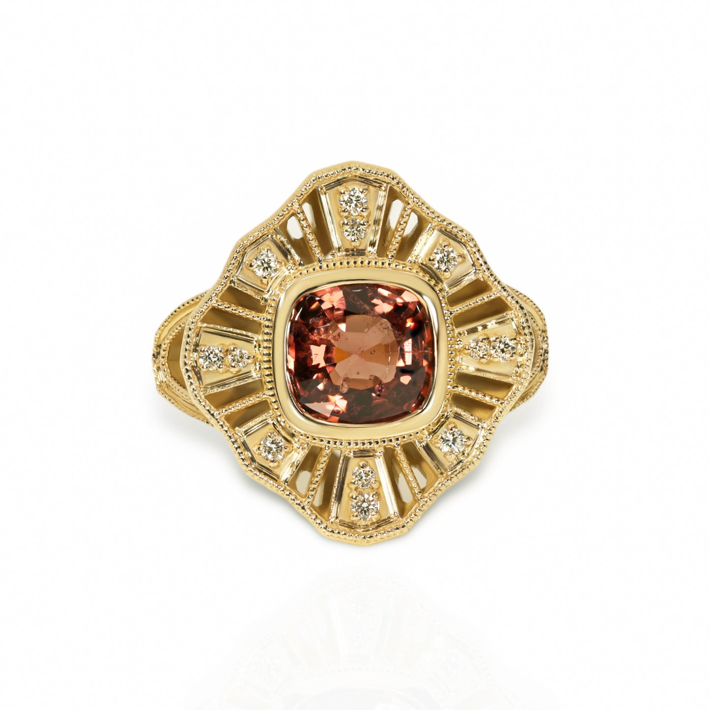 A 14kt yellow gold ring with a central spinel gemstone and accent diamonds
