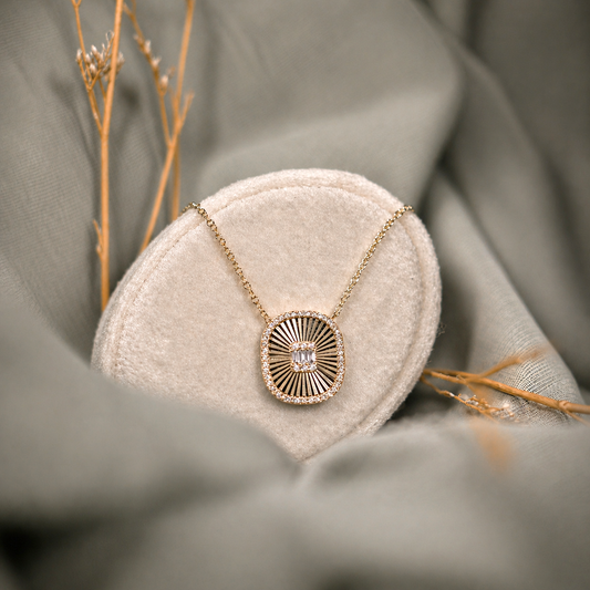 Diamond Sunburst Necklace on beige display with green background
