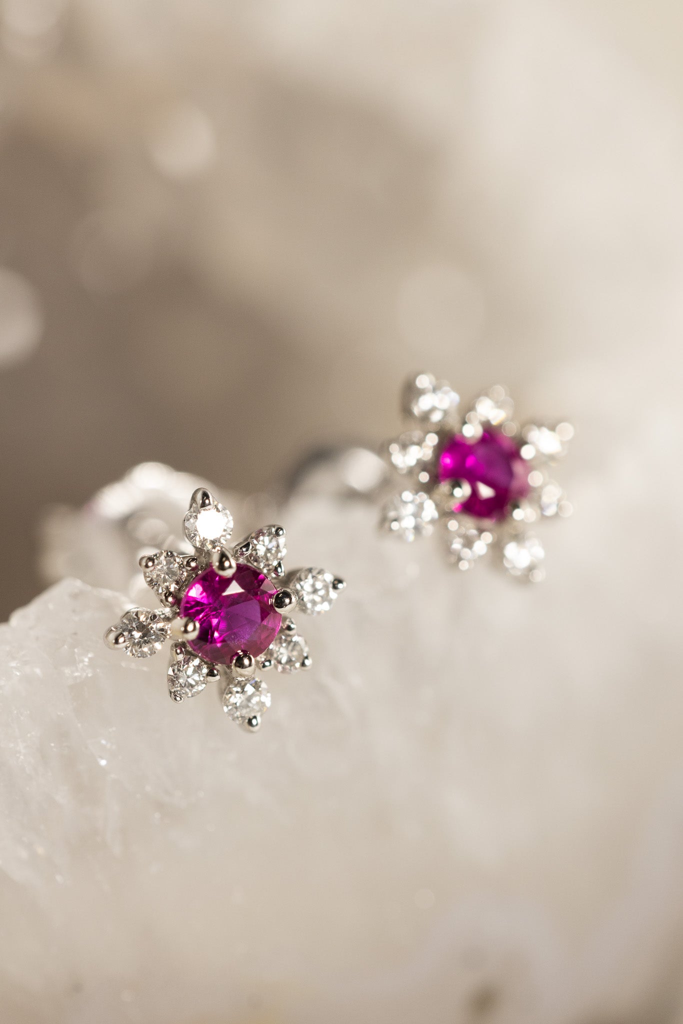 Ruby & Diamond Earrings with beige background