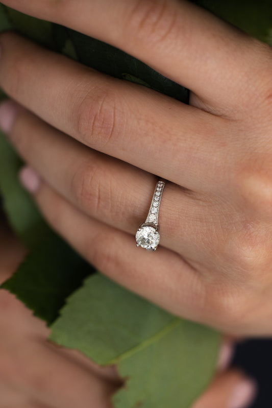 1.09 Carat Diamond Platinum Ring on hand with leaf background