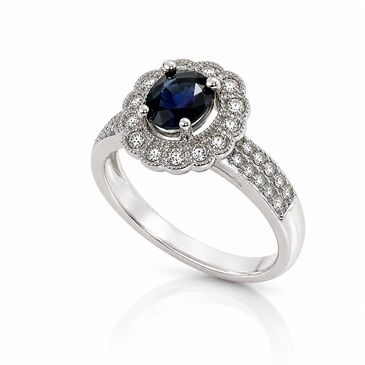 10K white gold ring featuring a 0.96 carat oval blue sapphire, scalloped diamond halo and diamond-accented band.