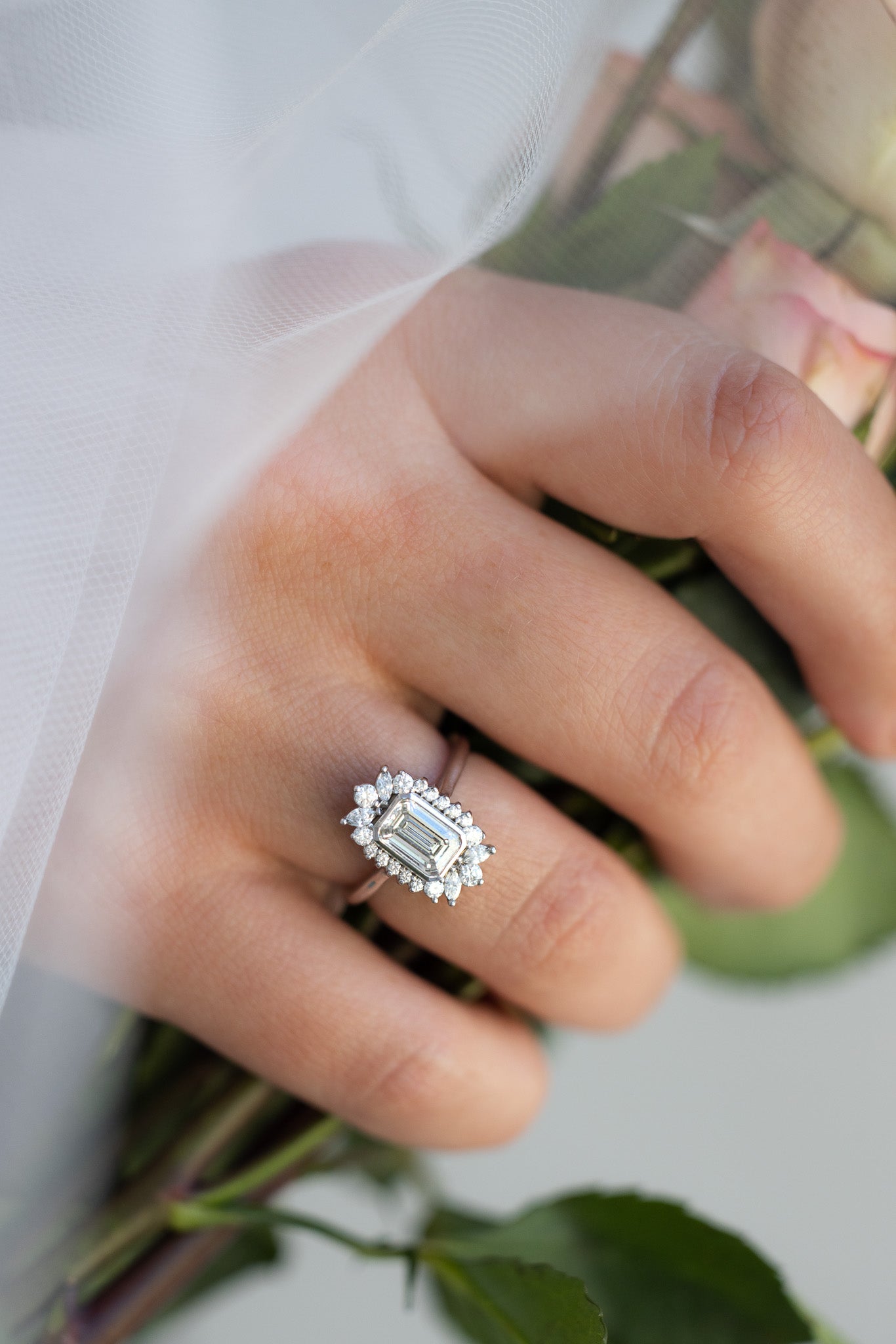 Bezel Set Halo Engagement Ring With Emerald Cut Diamond - GOODSTONE