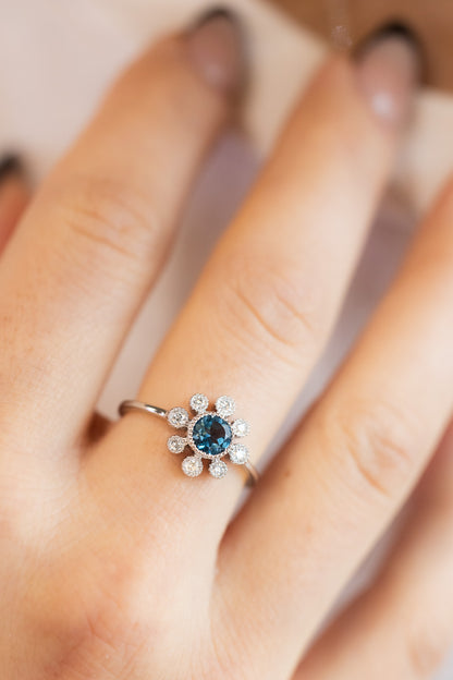 Blue Topaz & Diamond Ring on hand