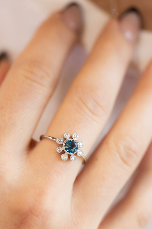 Blue Topaz & Diamond Ring on hand