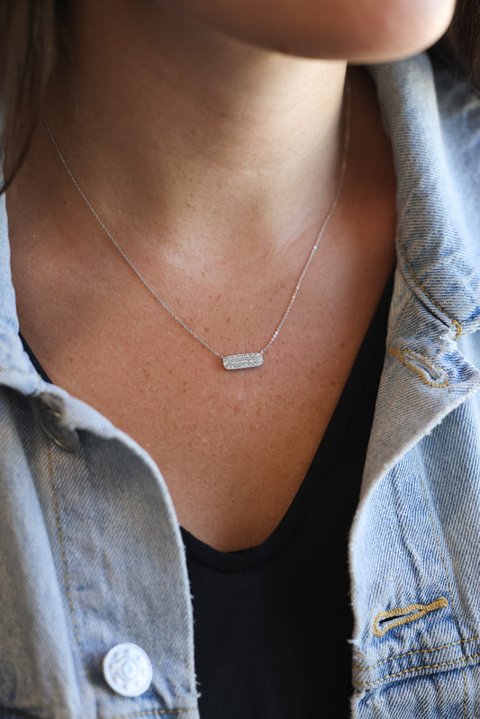 Diamond Pave' Bar Necklace on neck with black shirt and denim jacket