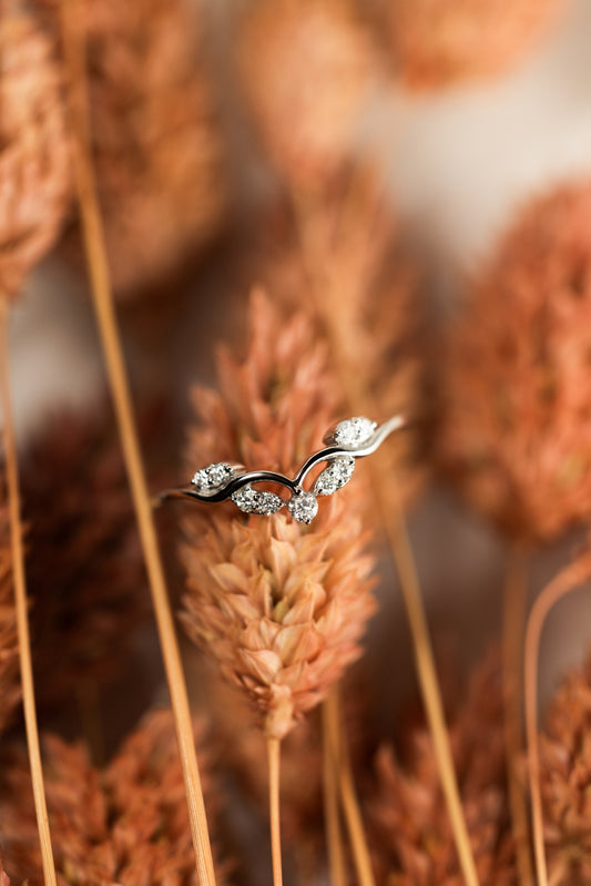 Diamond Tiara Ring with floral background
