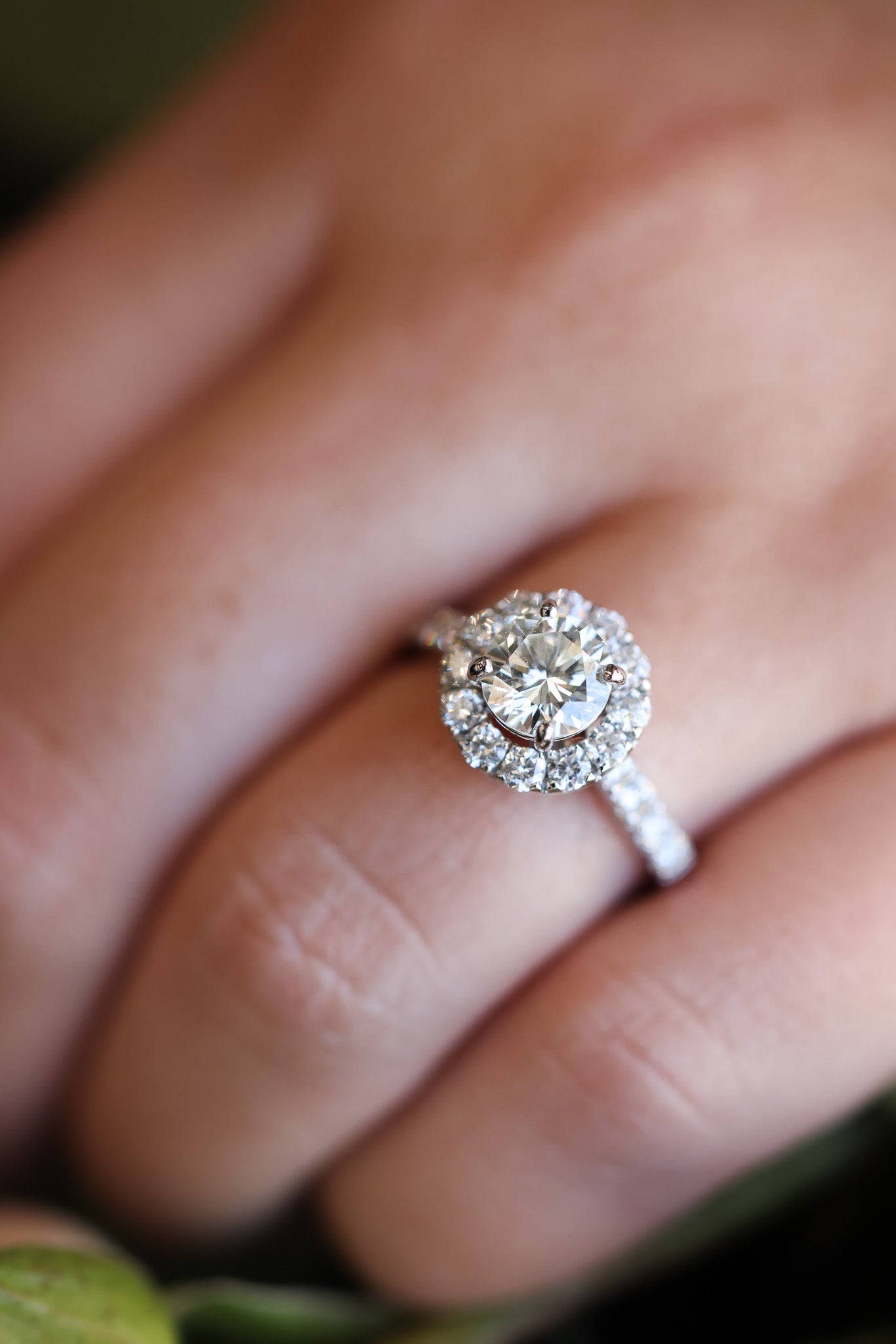 Diamond halo ring on hand