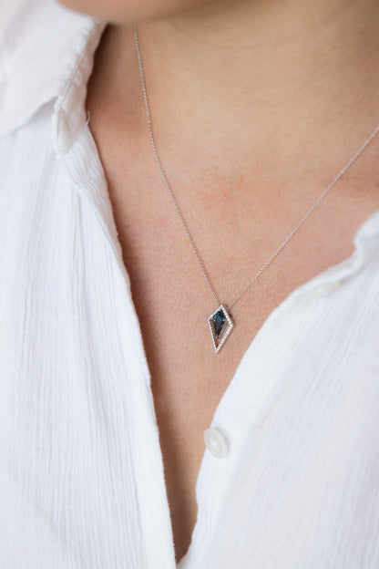 Kite Shape London Blue Topaz Necklace on woman's neck wearing white button up shirt