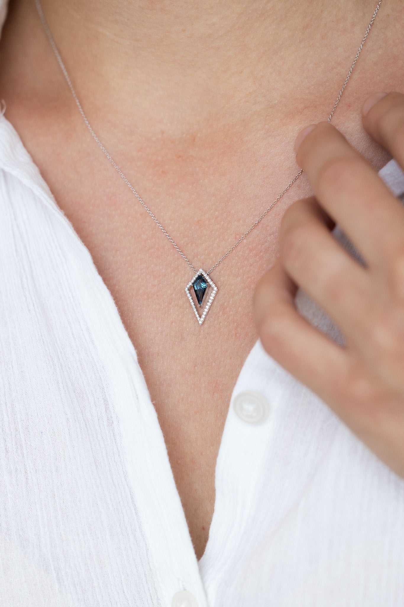 Kite Shape London Blue Topaz Necklace on lady with white shirt 