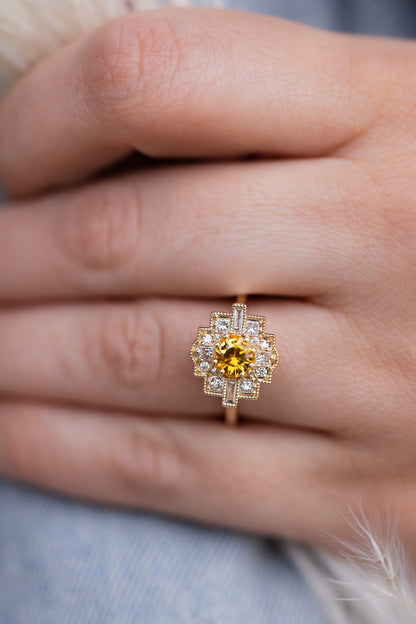 Orange Sapphire Ring on a finger