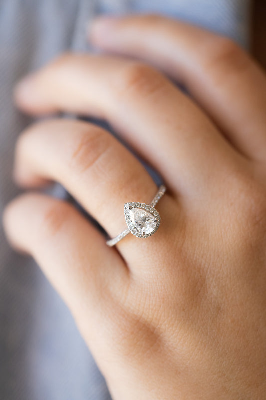 Pear Shape Halo Ring on lady's hand