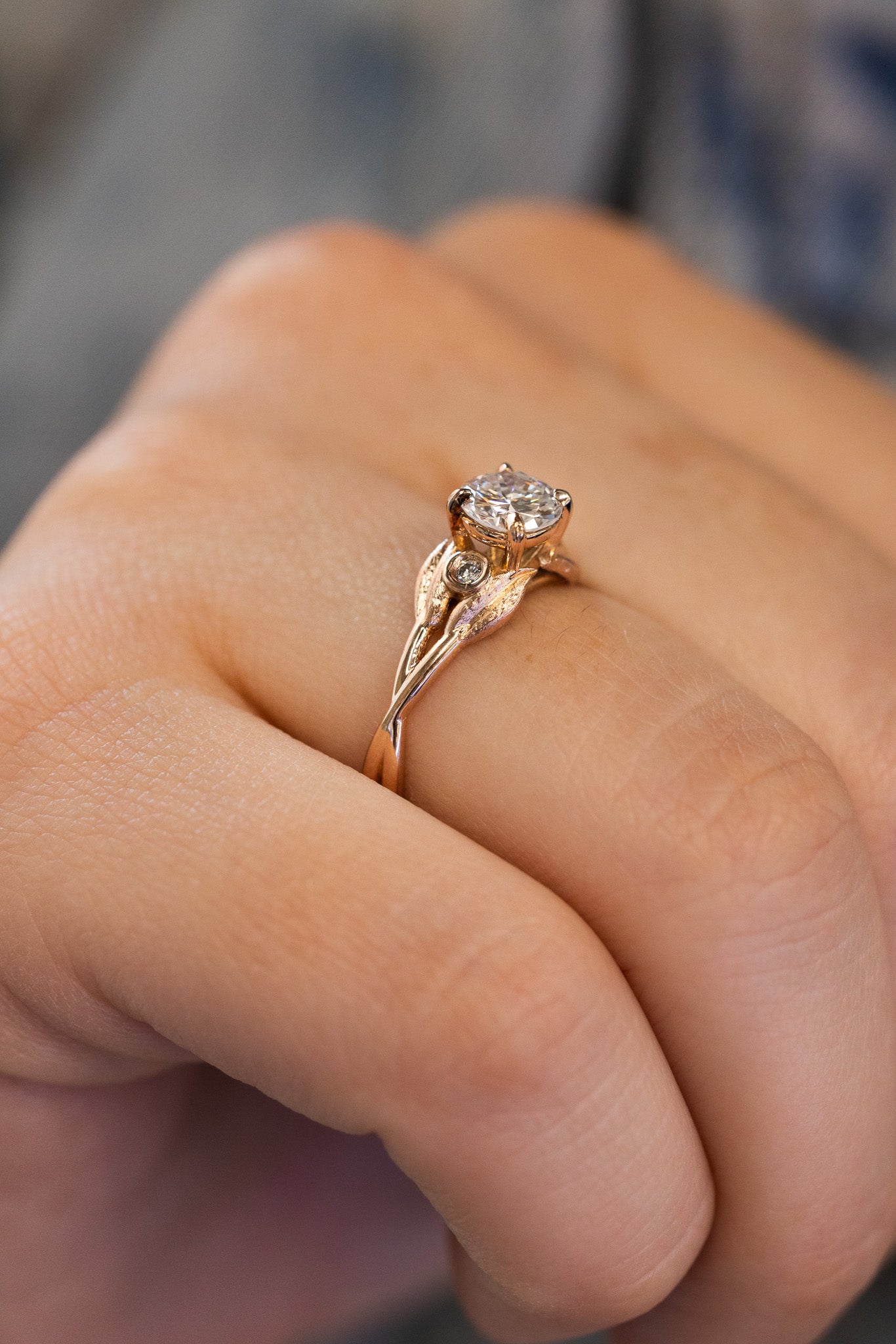14k Rose Gold Ring with Leaf Design 
.71 Carat Round Brilliant Diamond SI2 / F
.03 Carat t.w. Accent Diamonds on lady's hand