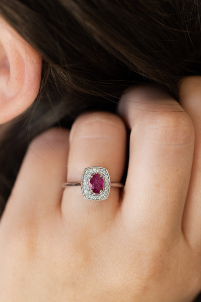 Oval Ruby Ring with Diamond all on hand of woman with dark hair