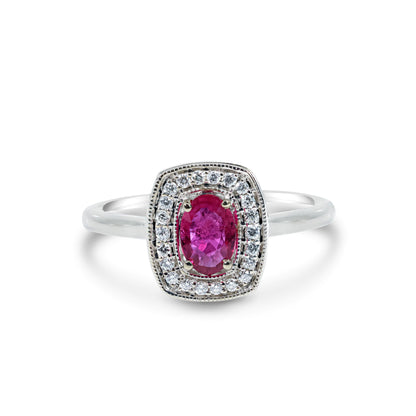 A 10k white gold ring featuring a 0.45 carat oval ruby and small diamond accents.