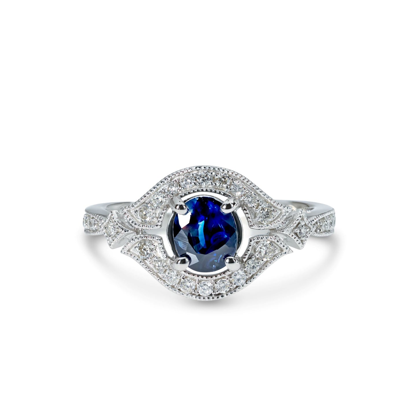 A 14k white gold ring with a blue sapphire in the center and accent diamonds set in a white gold band.
