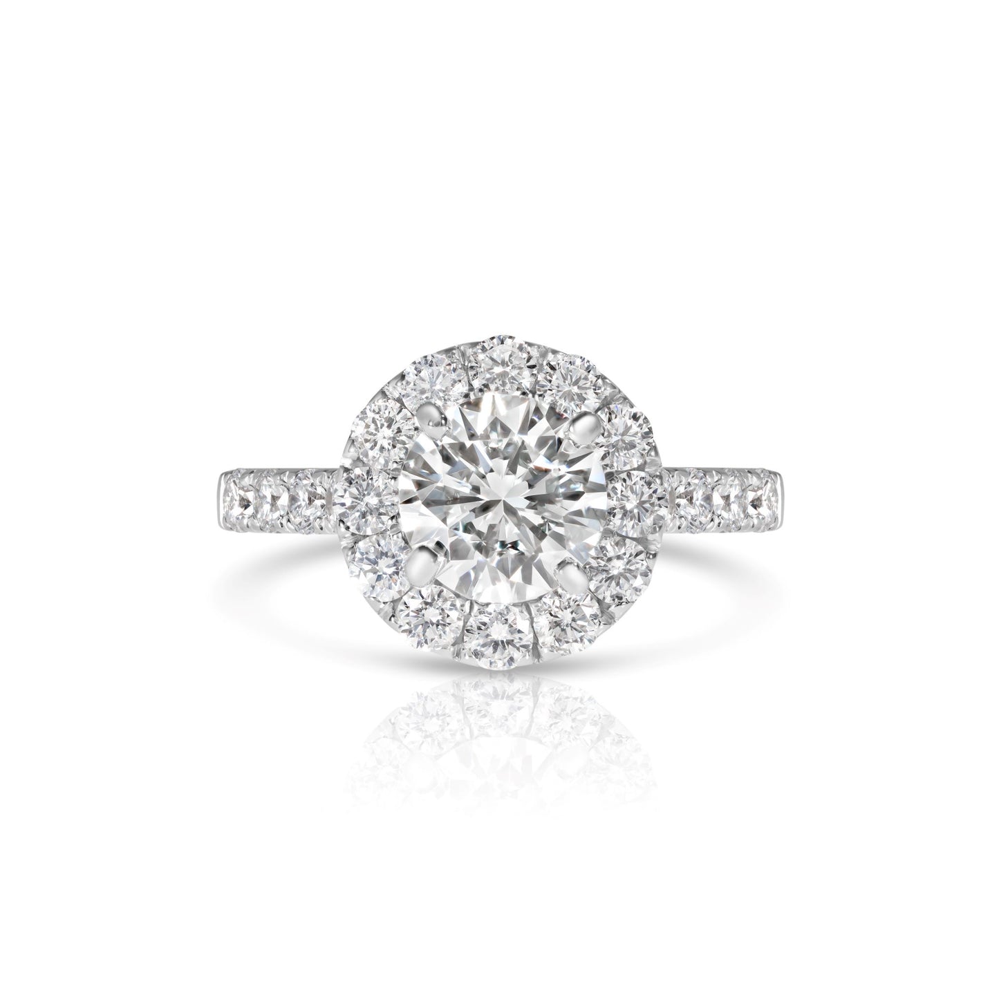 A 14K white gold wedding set featuring a round brilliant cut diamond with accent diamonds.