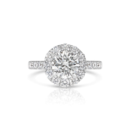 A 14K white gold wedding set featuring a round brilliant cut diamond with accent diamonds.