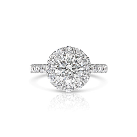 A 14K white gold wedding set featuring a round brilliant cut diamond with accent diamonds.