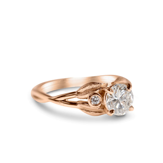 14k Rose Gold Ring with Leaf Design 
.71 Carat Round Brilliant Diamond SI2 / F
.03 Carat t.w. Accent Diamonds